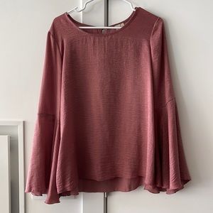 Woman’s Pink Bell Sleeved Top